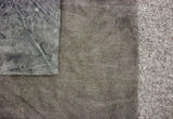 Thumb_close-up-of-grey-cloth-brown-cloth-and-dark-grey-cloth-layered-on-eachother