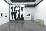 Thumb_3-paintings-on-the-wall-of-2-blacked-out-semi-ovals-barely-connecting-and-a-blacked-out-triangle-on-the-other-and-the-largest-3-black-and-white-humanoid-geometric-figures-and-leaning-against-wall-are-2-slabs-of-concrete-with-green-markings
